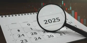 Calendar 2025 with magnifying glass over financial charts, representing COLA increase anticipation