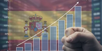 Gráfico de la deuda pública española superando el 100% del PIB hacia 2026, con una mano preocupada.