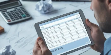 Person reviewing an unfair bill on a tablet, symbolizing billing dispute resolution